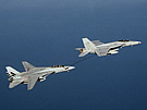 AIR F-18E Refuels F-14