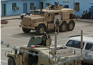 LAND_Cougar_6x6_and_Polish_HMMWV_Iraq.jpg