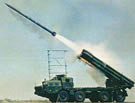 LAND_Smerch_9K58_MLRS_Firing.jpg