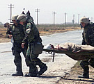 MED_US_Corpsmen_Carry_Iraqi_Soldier.jpg